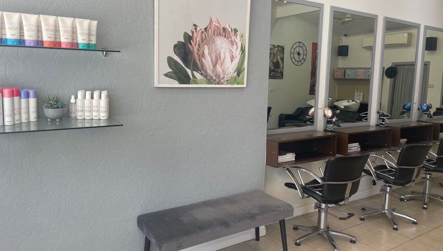 Modern salon interior at R Hair 4 U, Normanhurst, NSW, AU with styling chairs and elegant decor.