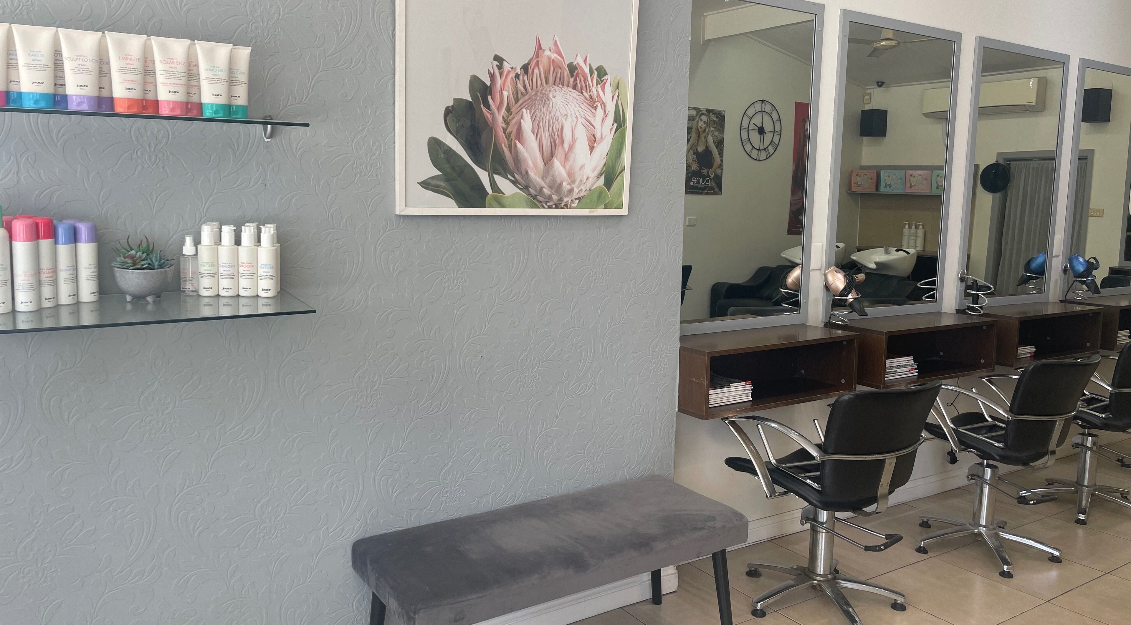 Modern salon interior at R Hair 4 U, Normanhurst, NSW, AU with styling chairs and elegant decor.