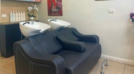 Luxurious rinse station at R Hair 4 U, Normanhurst, NSW, AU, featuring plush seating and modern design.