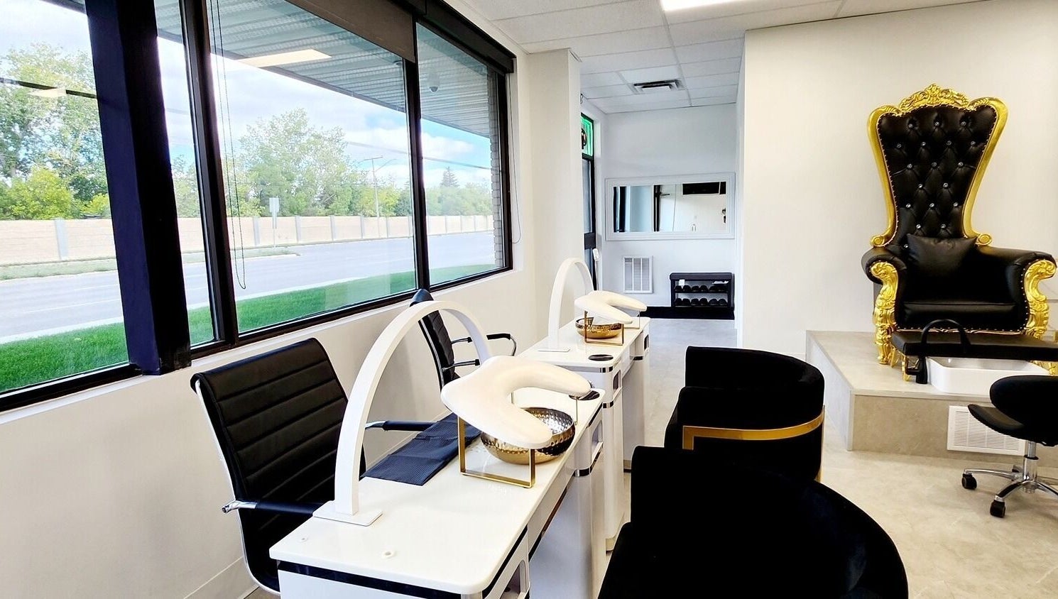 Luxurious seating area at Blissful Spa, Saskatoon, Saskatchewan, CA, with elegant pedicure chairs.
