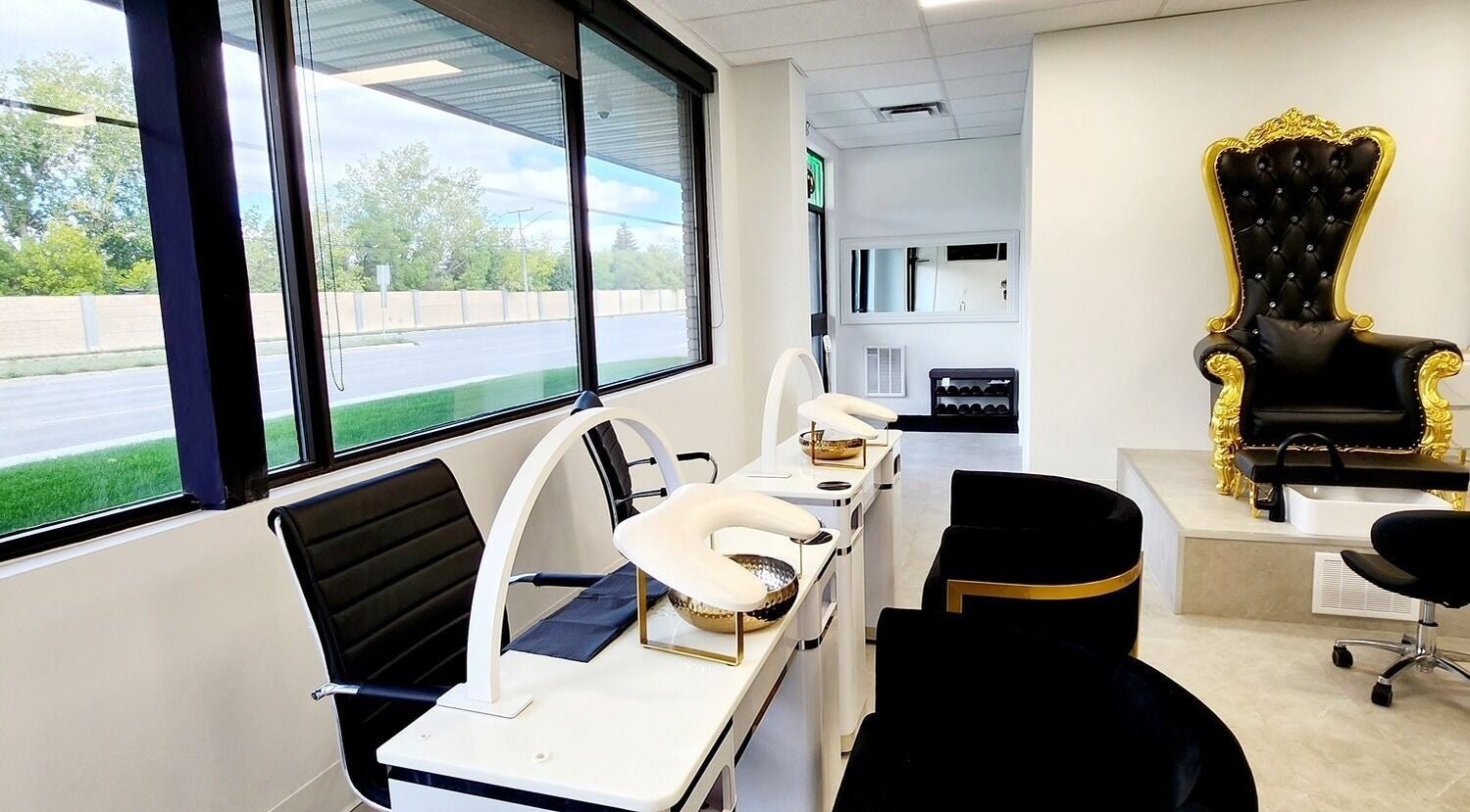 Luxurious seating area at Blissful Spa, Saskatoon, Saskatchewan, CA, with elegant pedicure chairs.