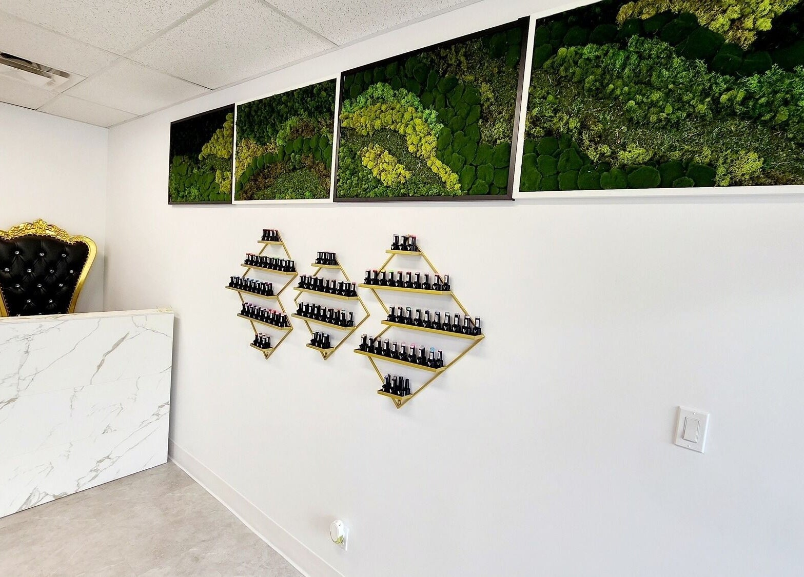 Elegant reception desk and decor at Blissful Spa, Saskatoon, Saskatchewan, CA, with nail polish display.