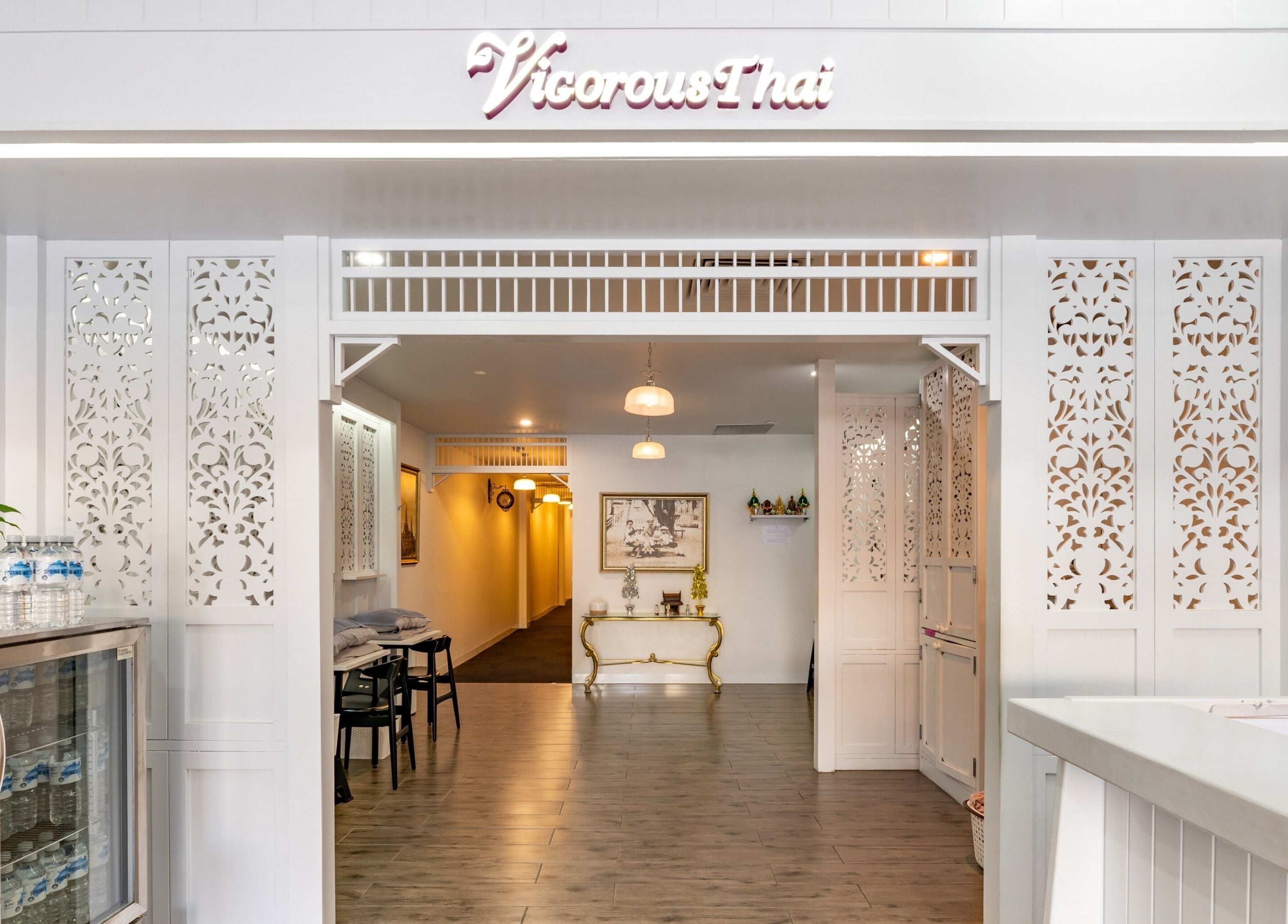 Elegant entrance of Vigorous Thai - Moonee Ponds in Victoria, AU, showcasing intricate white decor.