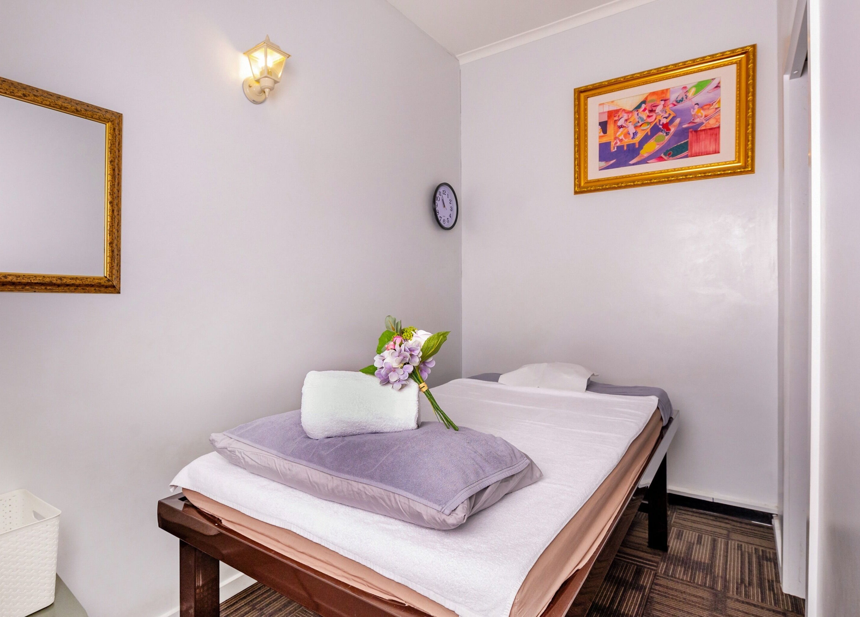 Relaxing massage room at Vigorous Thai - West Melbourne, featuring a cozy bed and serene decor in West Melbourne, Victoria, AU.