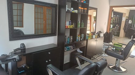 Modern interior of Meneer Barbershop with stylish chairs in Boksburg, Gauteng, ZA.