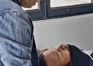 Barber at Meneer Barbershop in Boksburg, Gauteng, ZA providing grooming service to a client.