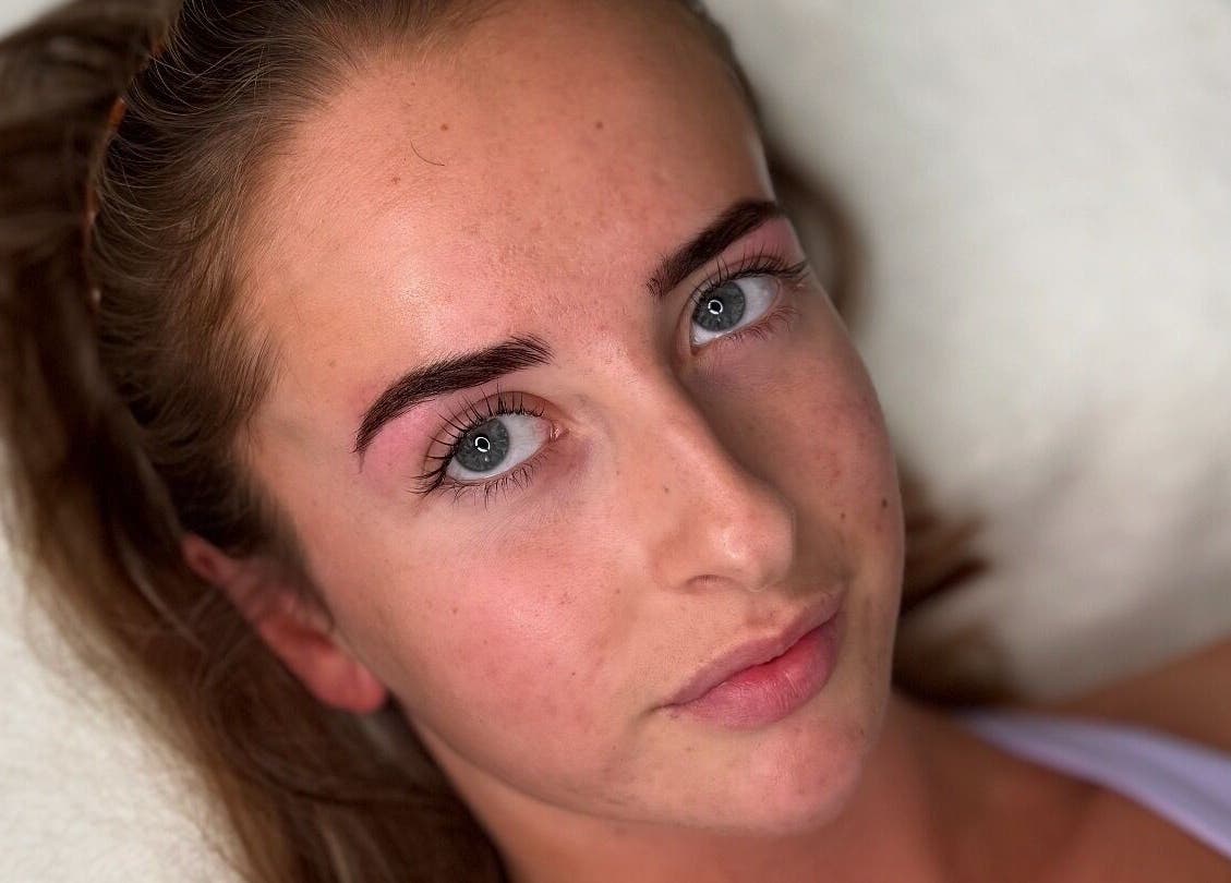 Woman with perfect skin after facial at Bare Beauty by Vici, Andover, England, GB.