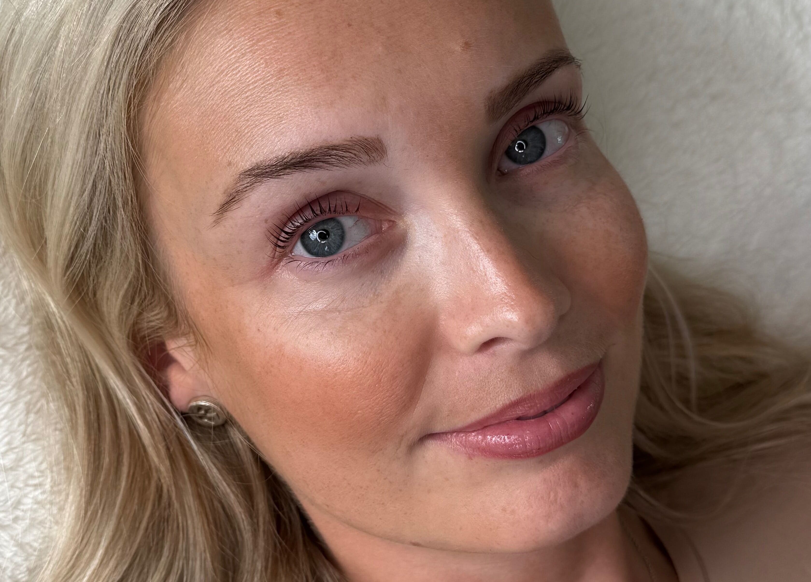 Close-up of a woman's radiant skin at Bare Beauty by Vici, Andover, England, GB showcasing natural beauty.