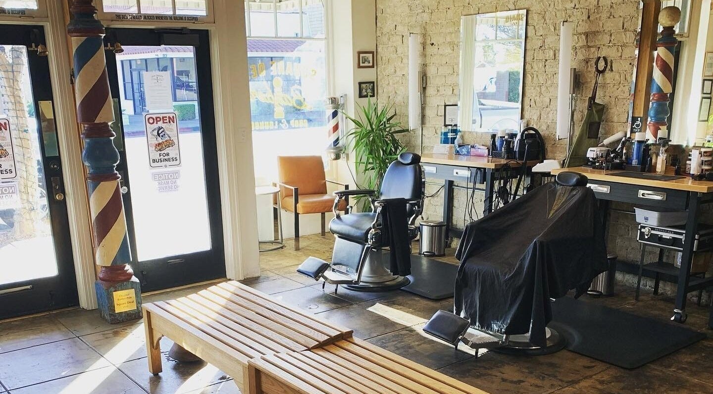 Cozy interior of Square Deal Barber Shop, South Pasadena, California, US, featuring classic barber chairs.
