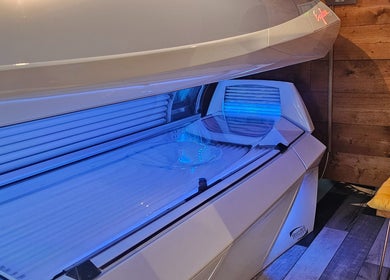 Modern tanning bed at Eclipse Tanning Studio in Launceston, Cornwall, GB, offering premium tanning experiences.