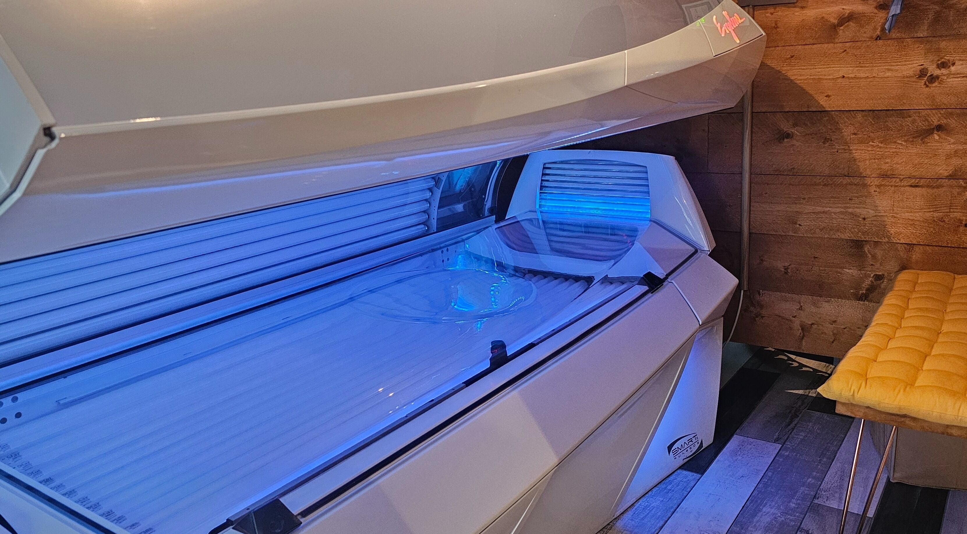 Modern tanning bed in Eclipse Tanning Studio Ltd, Launceston (Anglia), Cornwall, GB. Cozy wooden interior and bright light.