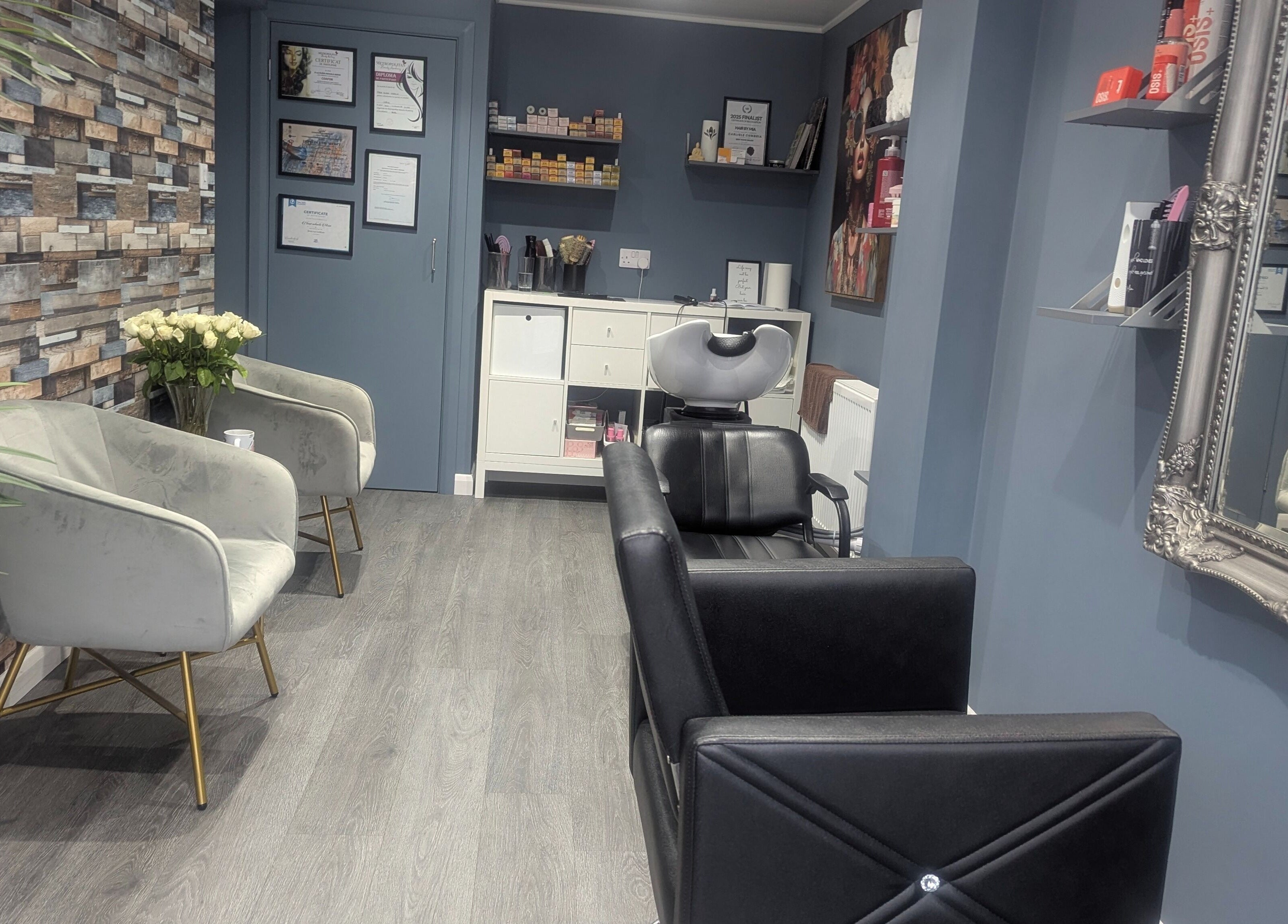 Modern interior of Hair By Mia salon in Carlisle, England, GB, featuring chic seating and stylish decor.