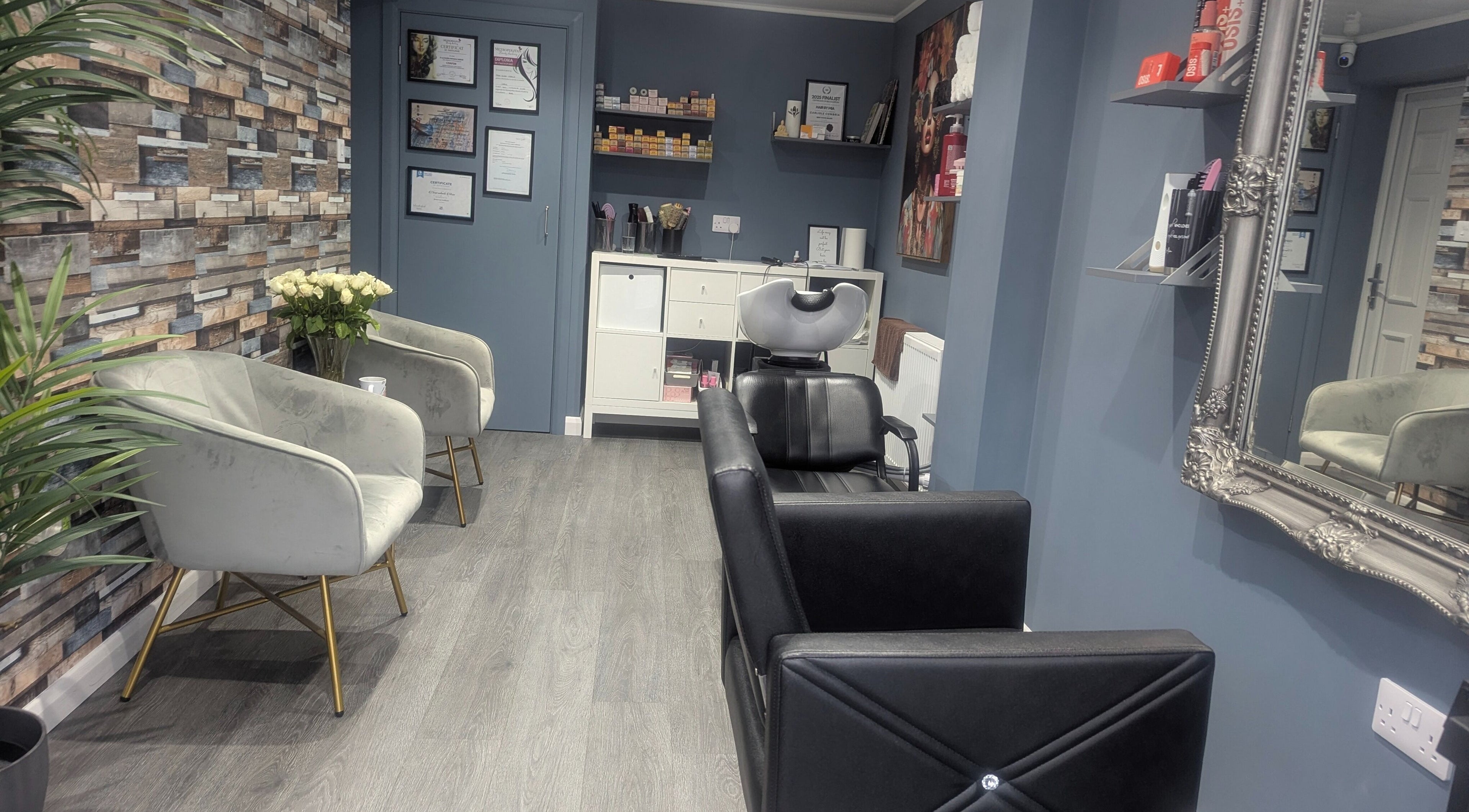 Modern interior of Hair By Mia salon in Carlisle, England, GB, featuring chic seating and stylish decor.