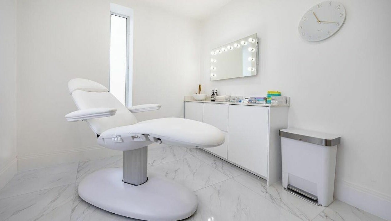 Elegant treatment room at Pout, Whitefield, England, GB, featuring a modern chair and stylish decor.