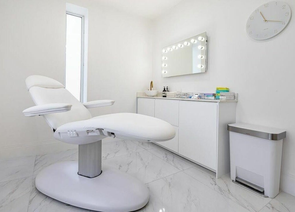 Elegant treatment room at Pout, Whitefield, England, GB, featuring a modern chair and stylish decor.