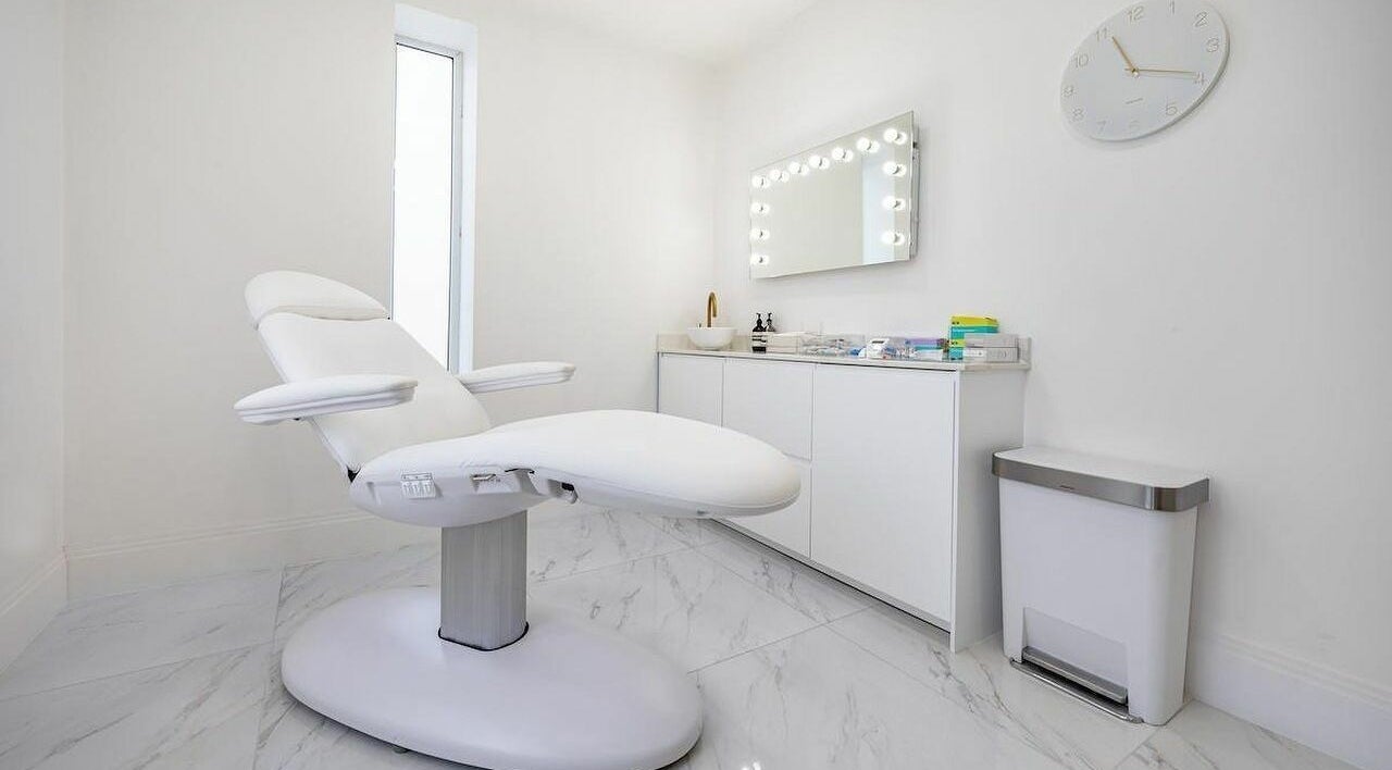 Elegant treatment room at Pout, Whitefield, England, GB, featuring a modern chair and stylish decor.