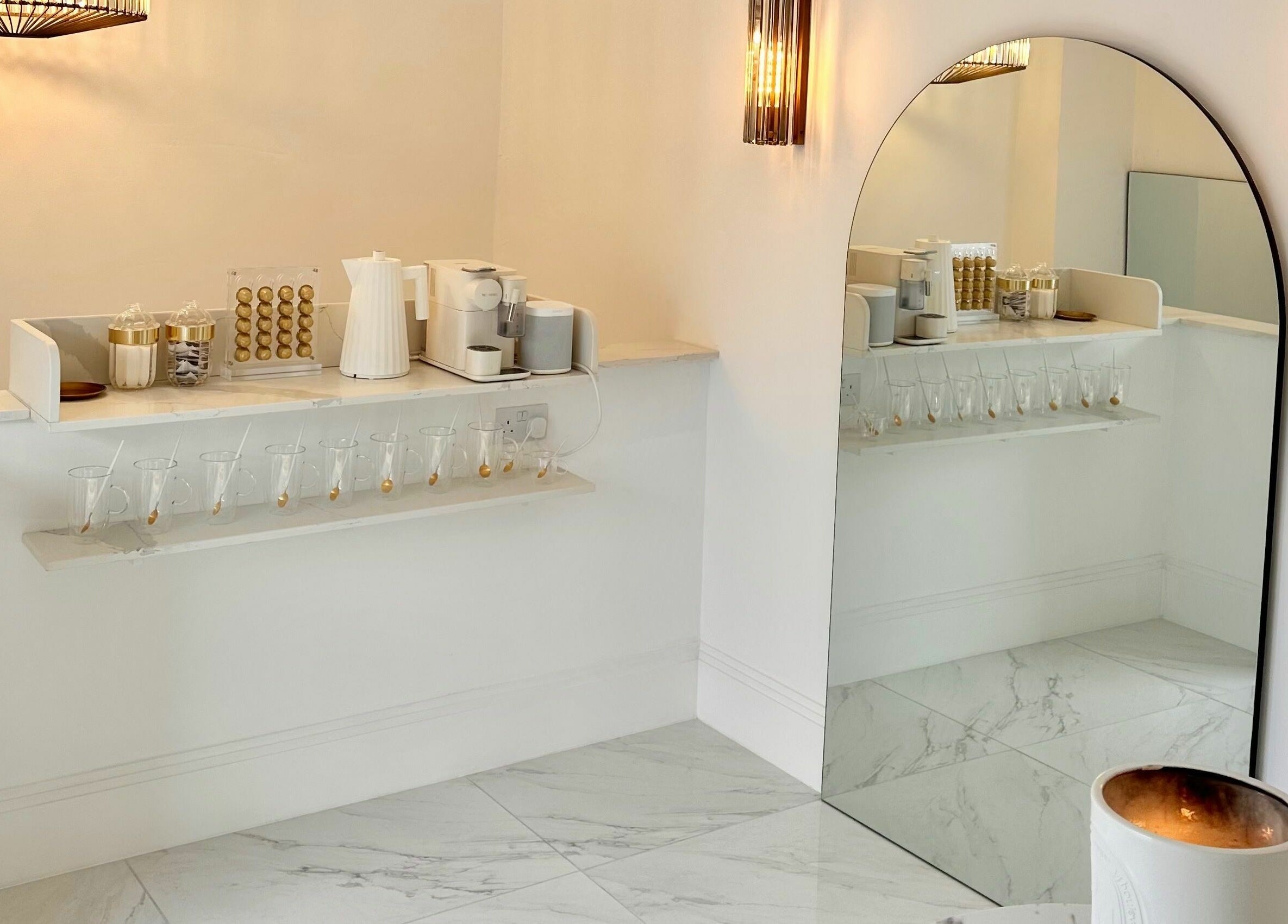 Chic refreshment area at Pout, Whitefield, England, GB with large mirror emphasizing elegance.