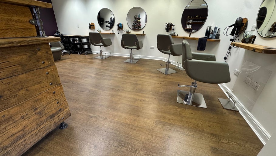 Stylish salon chairs and mirrors at Kai @ Opulent Hair & Beauty, Cudworth, England, GB.