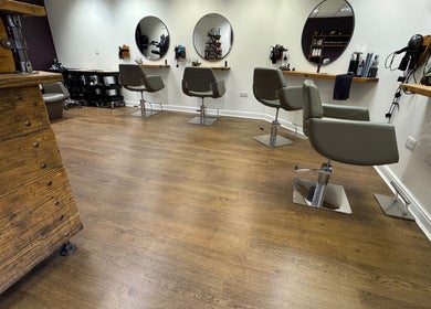 Stylish salon chairs and mirrors at Kai @ Opulent Hair & Beauty, Cudworth, England, GB.