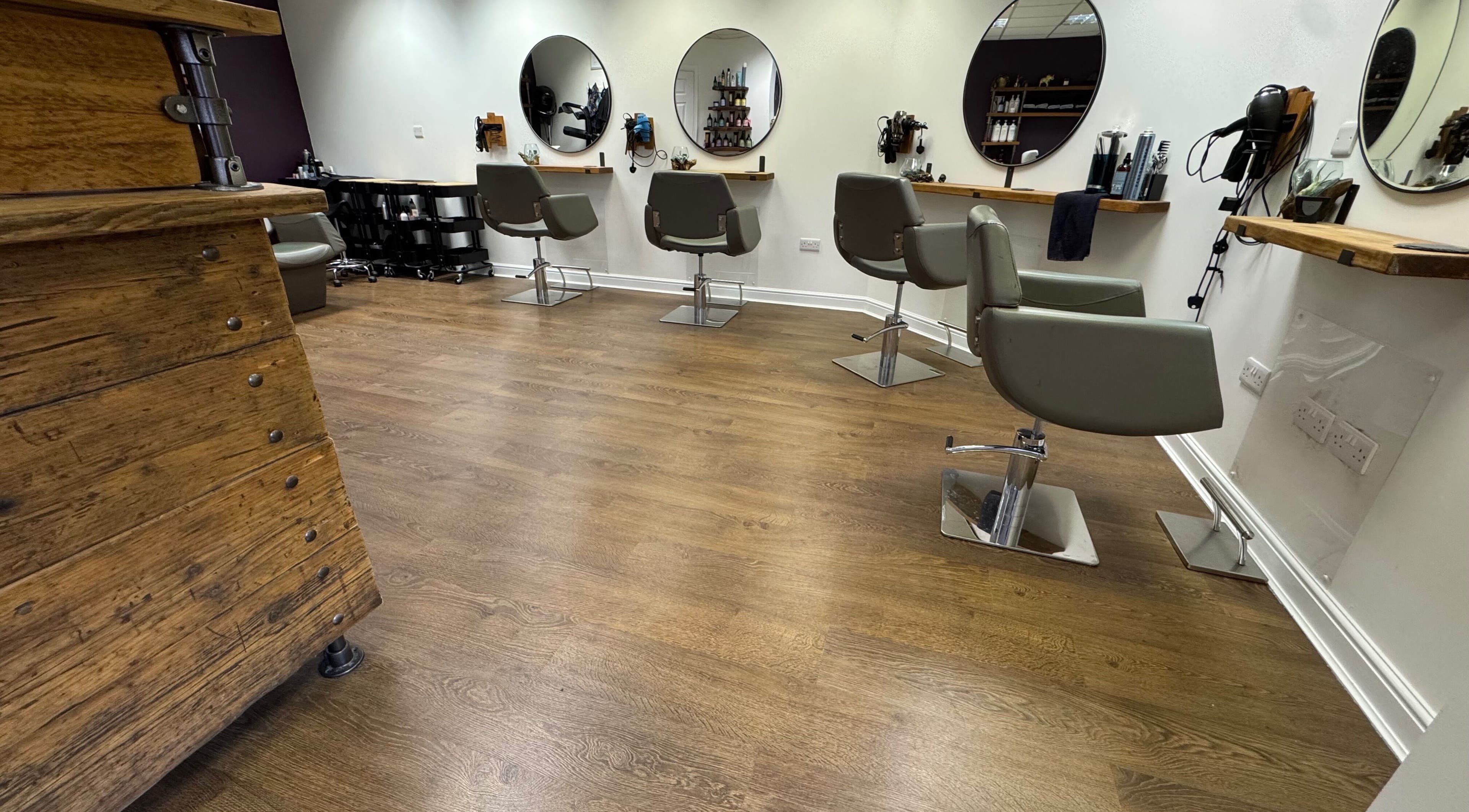 Stylish salon chairs and mirrors at Kai @ Opulent Hair & Beauty, Cudworth, England, GB.