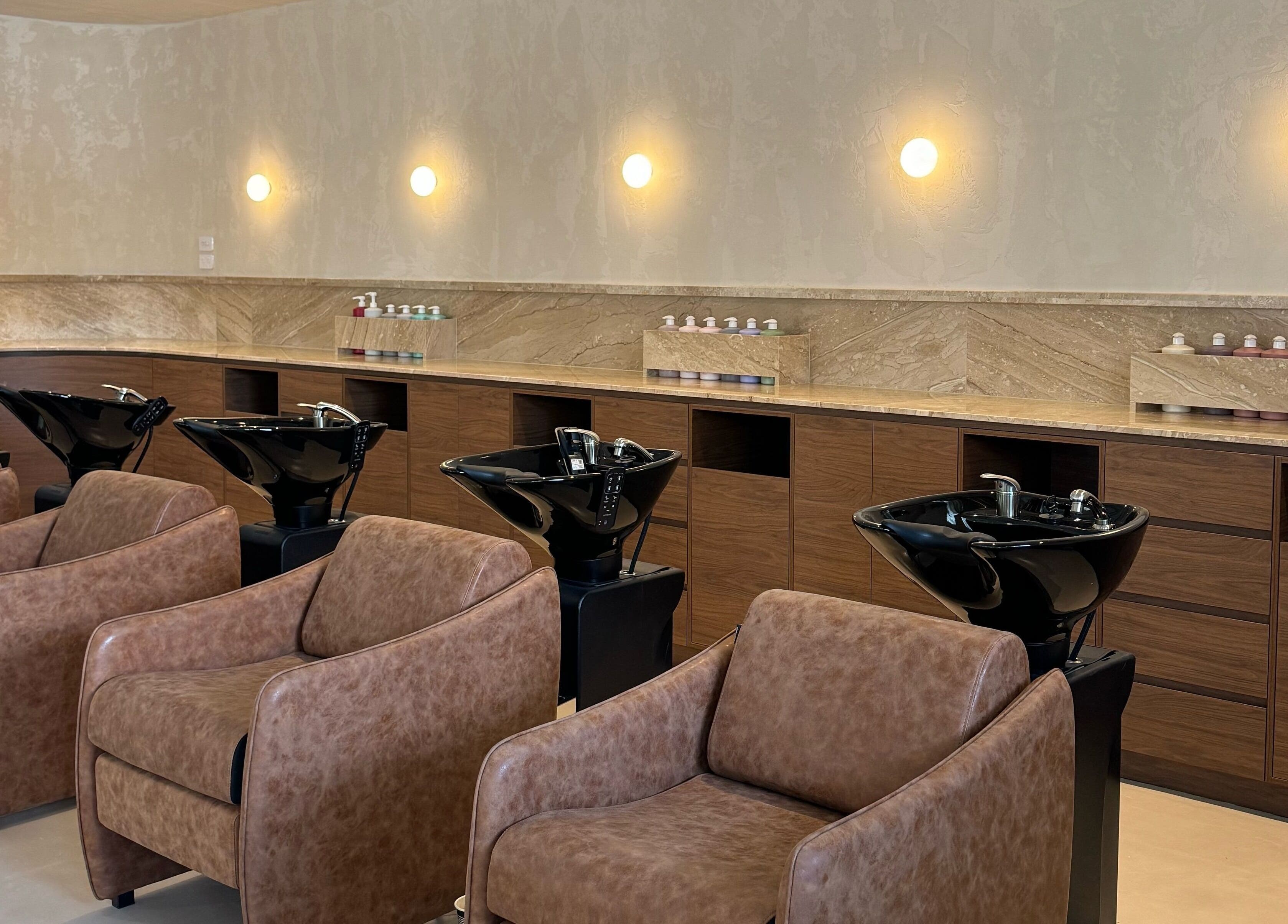 Stylish wash stations at Blondee | Burleigh, Burleigh Waters, Queensland, AU in luxurious salon setting.