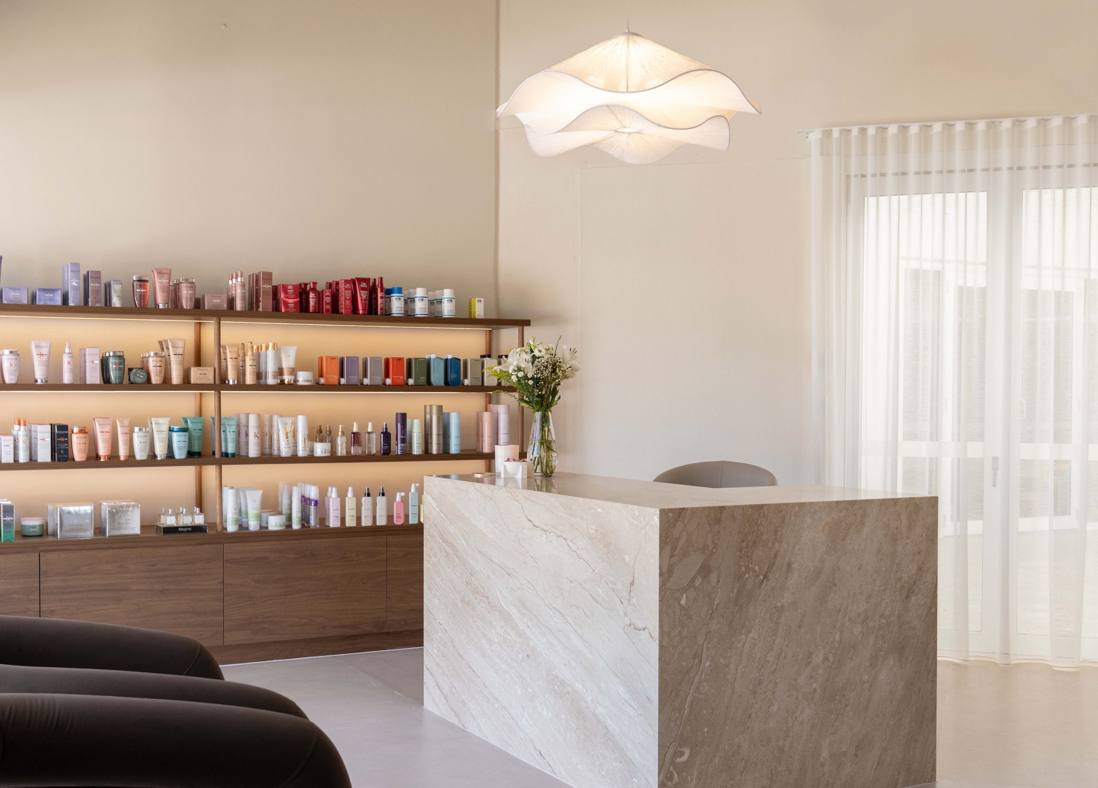 Chic reception at Blondee | Burleigh with product shelves in Burleigh Waters, Queensland, AU.