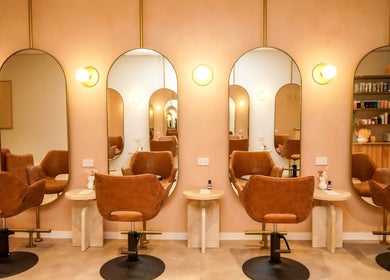 Stylish beauty salon interior at Blondee | Morningside, Queensland, AU with chic seating and mirrors.