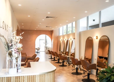 Modern interior of Blondee | Newstead salon in Newstead, Queensland, AU with chic mirrors and stylish seating.
