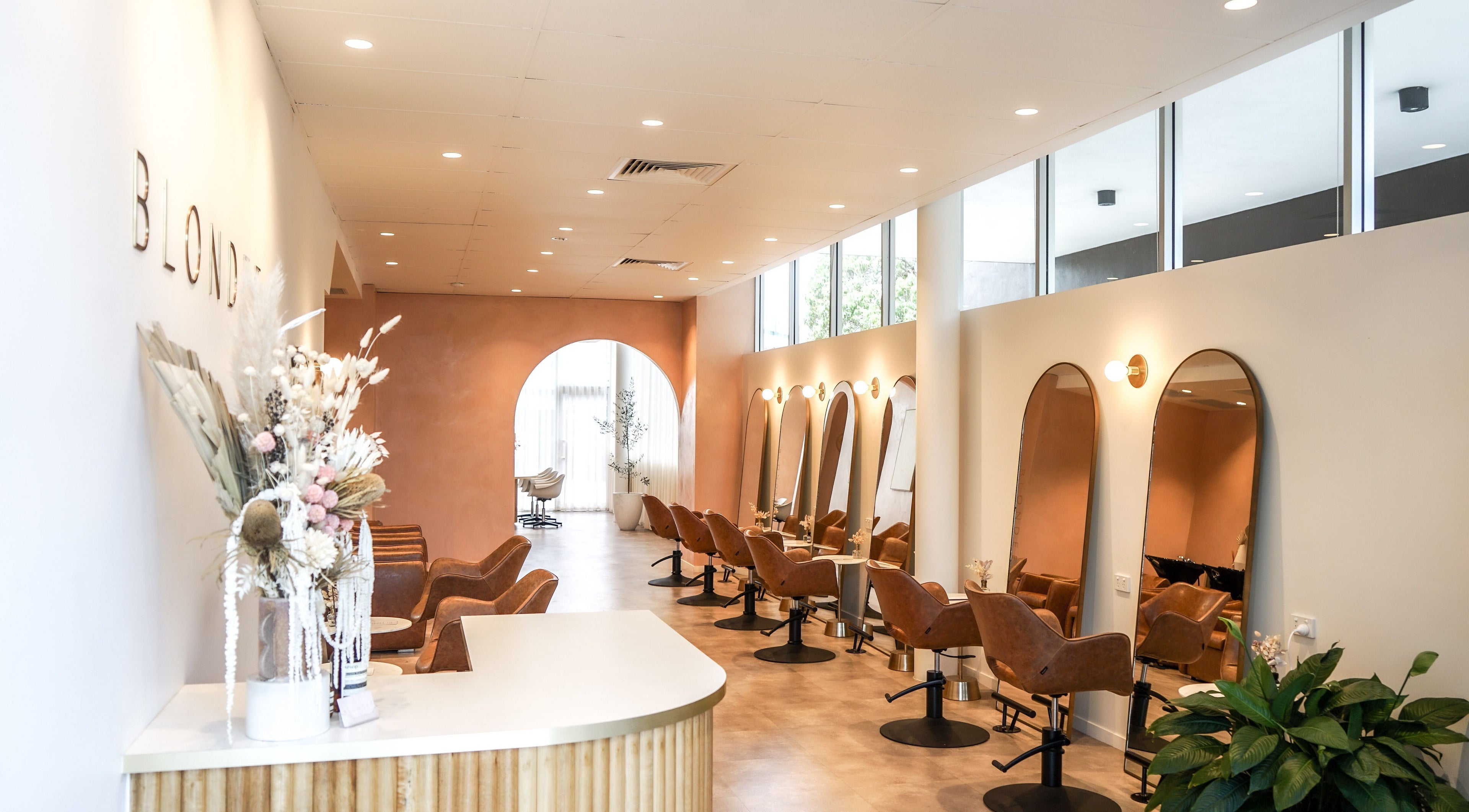 Modern interior of Blondee | Newstead salon in Newstead, Queensland, AU with chic mirrors and stylish seating.