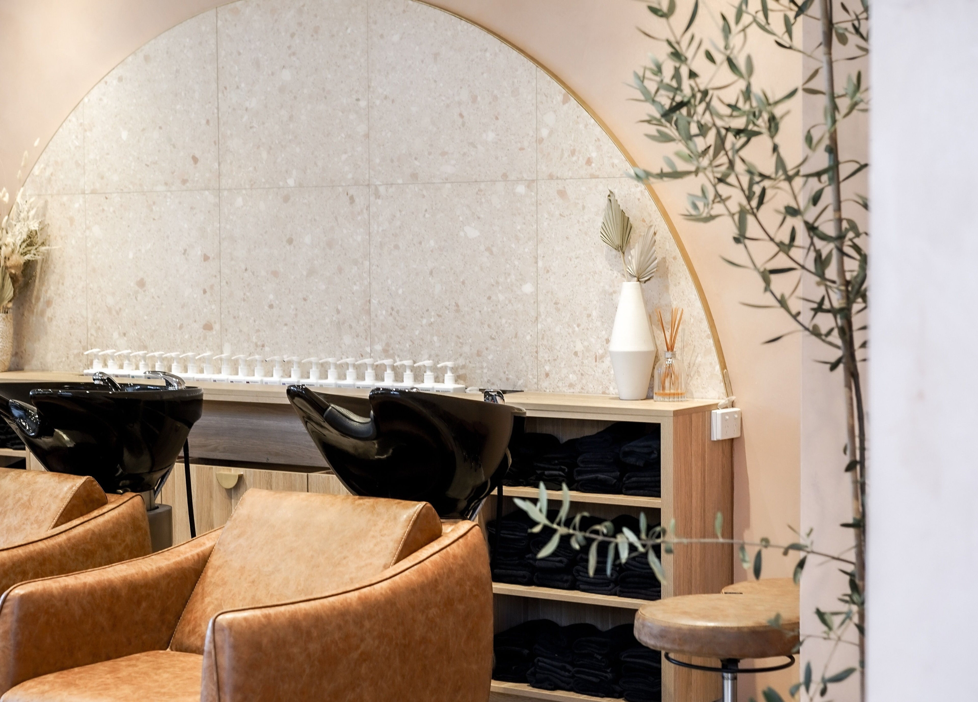 Stylish interior of Blondee | Newstead salon in Newstead, Queensland, AU with modern chairs and decor.