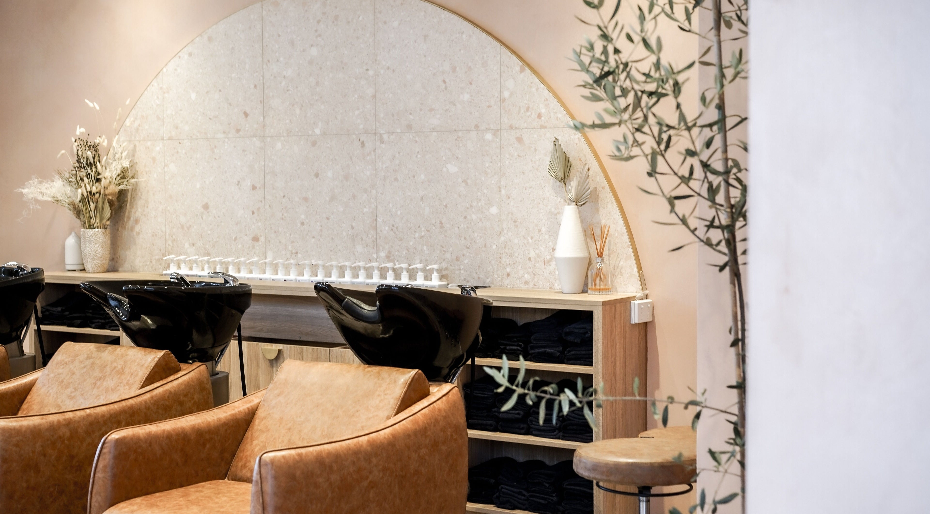 Stylish interior of Blondee | Newstead salon in Newstead, Queensland, AU with modern chairs and decor.