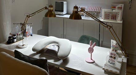 Elegant nail station at Nails By Lexie, Montréal, Québec, CA with modern fixtures and nail color samples.