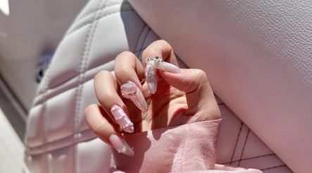 Intricate nail art design from Nails By Lexie in Montréal, Québec, CA with pink and crystal accents.