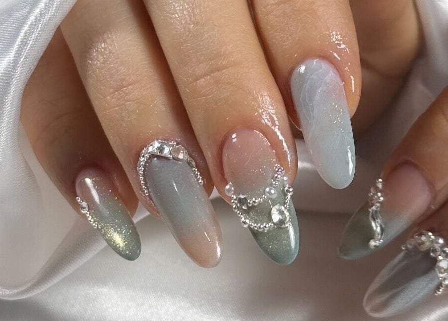 Elegant gradient nail art with gemstones at Tipsy By Lexie, Montréal, Québec, CA.