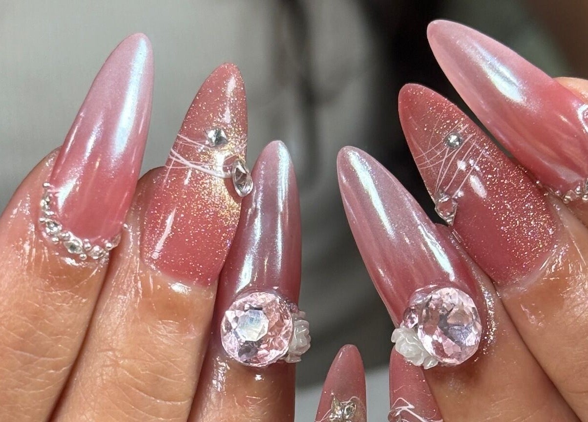 Elegant pink nails with gems at Tipsy By Lexie, Montréal, Québec, CA. Perfect for a chic mani-pedi experience.