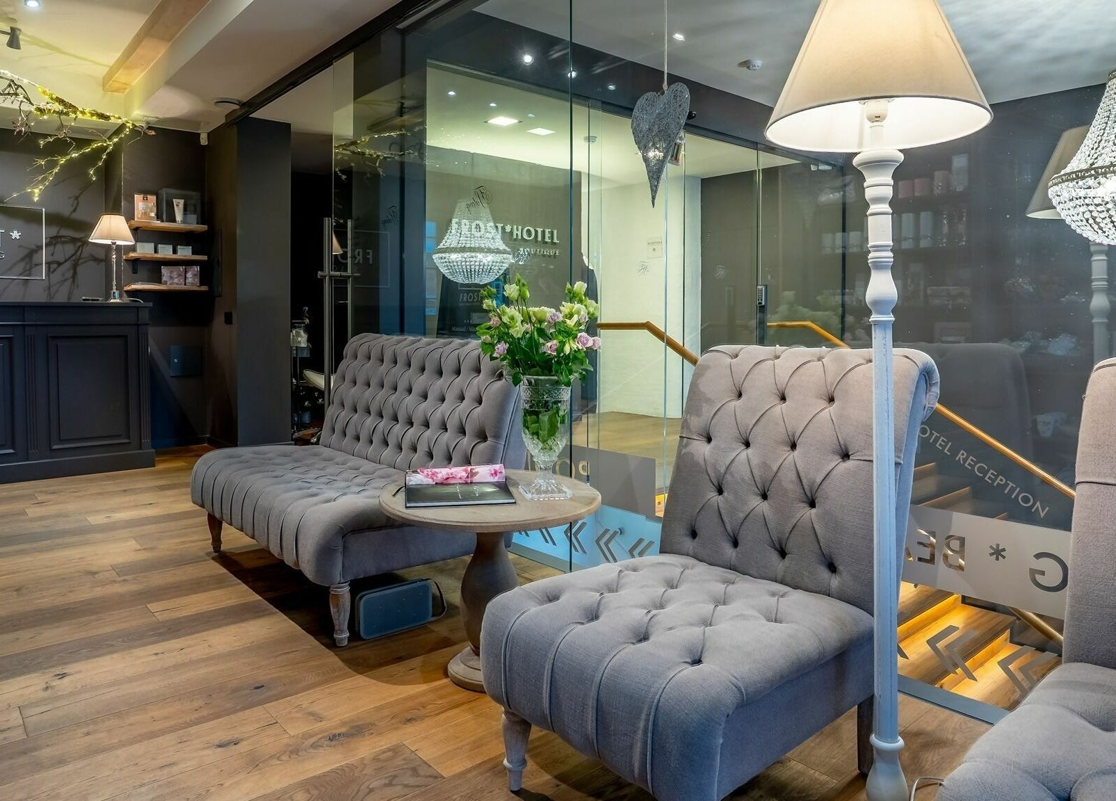 Chic lounge area at Frost Salong, featuring plush seating and chandelier lighting in Pärnu, Pärnu Maakond, EE.