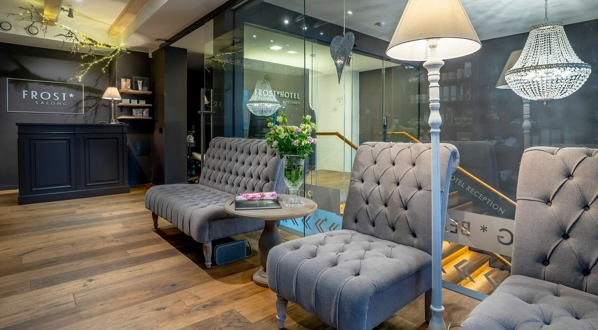 Chic lounge area at Frost Salong, featuring plush seating and chandelier lighting in Pärnu, Pärnu Maakond, EE.