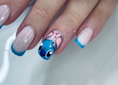 Nail art featuring blue cartoon design at Lenails Beauty Salon in Krugersdorp, Gauteng, ZA.