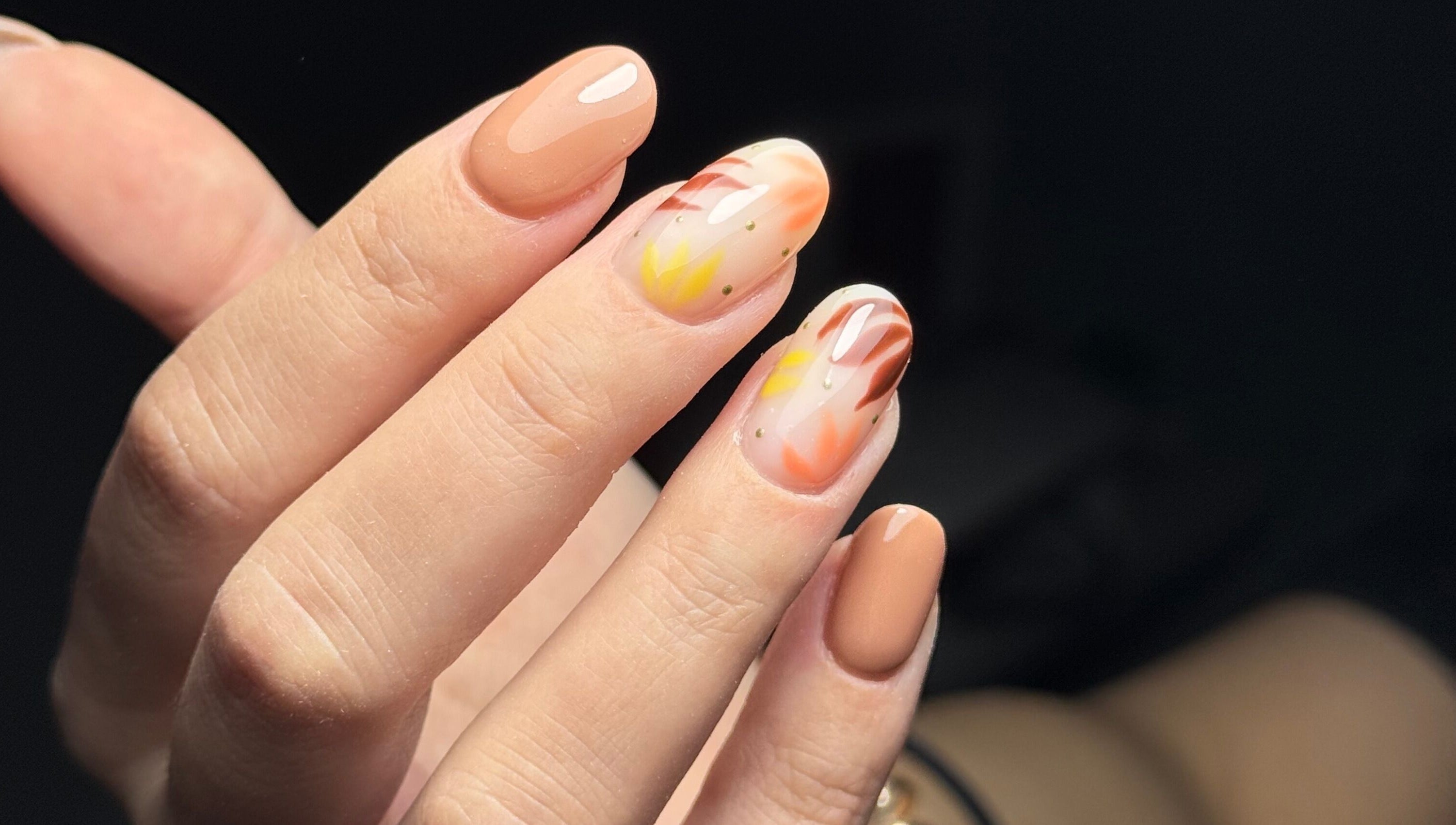 Intricate nail art design at The Flying Nail Tech, Middlewich, England, GB, showcasing vibrant fall colors.