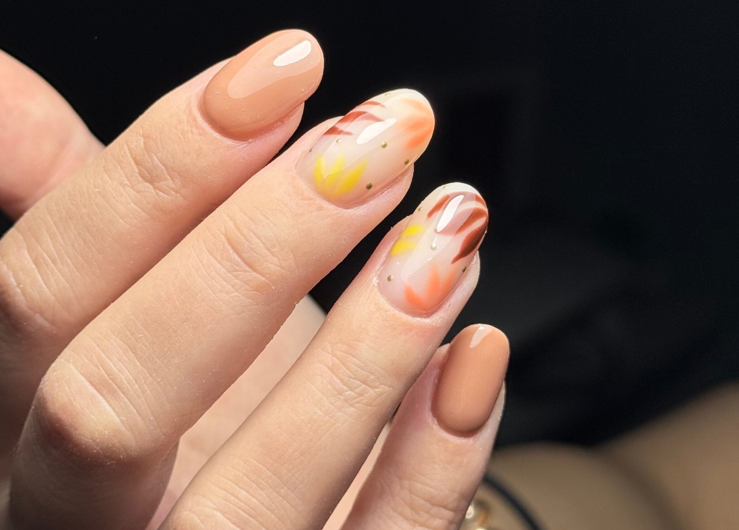 Intricate nail art design at The Flying Nail Tech, Middlewich, England, GB, showcasing vibrant fall colors.