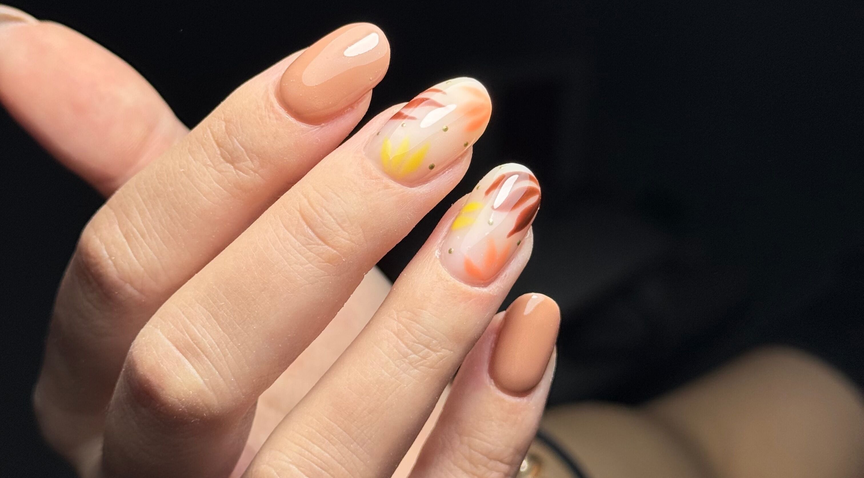 Intricate nail art design at The Flying Nail Tech, Middlewich, England, GB, showcasing vibrant fall colors.