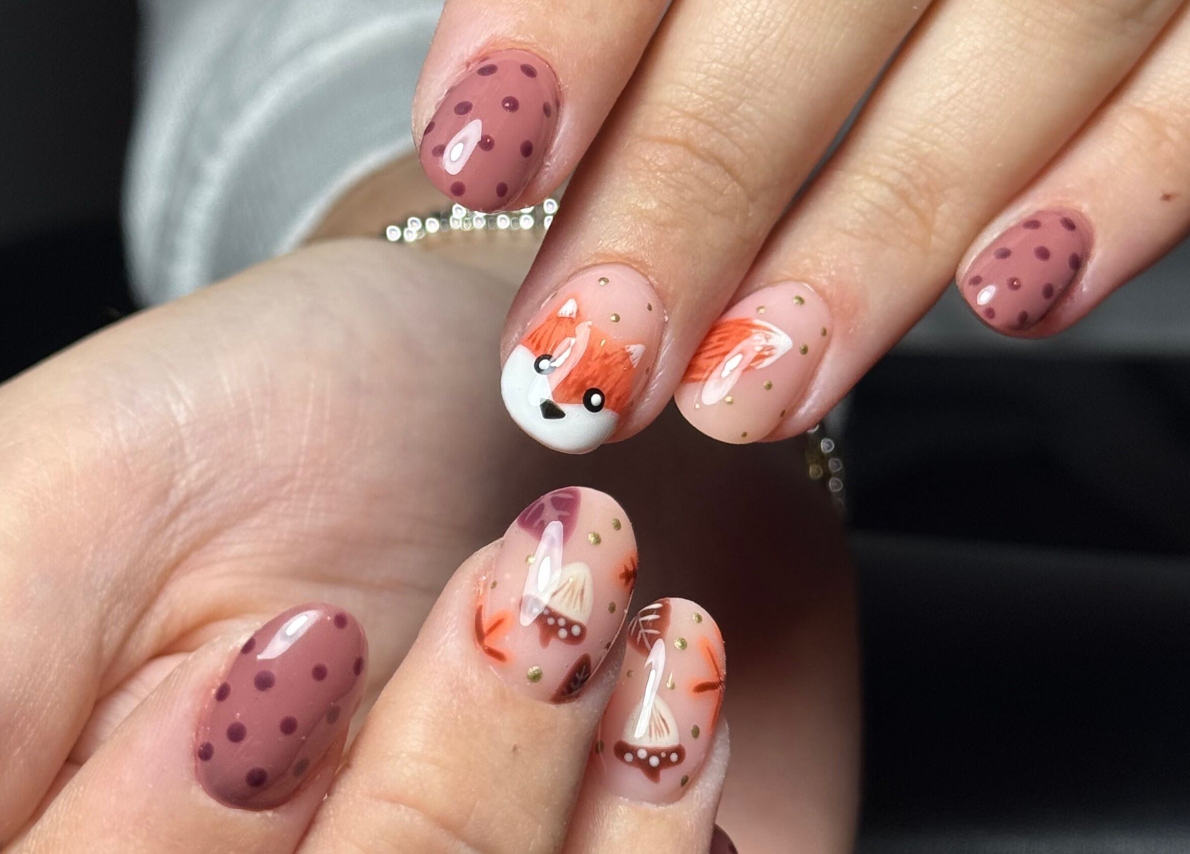 Whimsical nail art at The Flying Nail Tech, Middlewich, England, GB, featuring fox and polka dot designs.