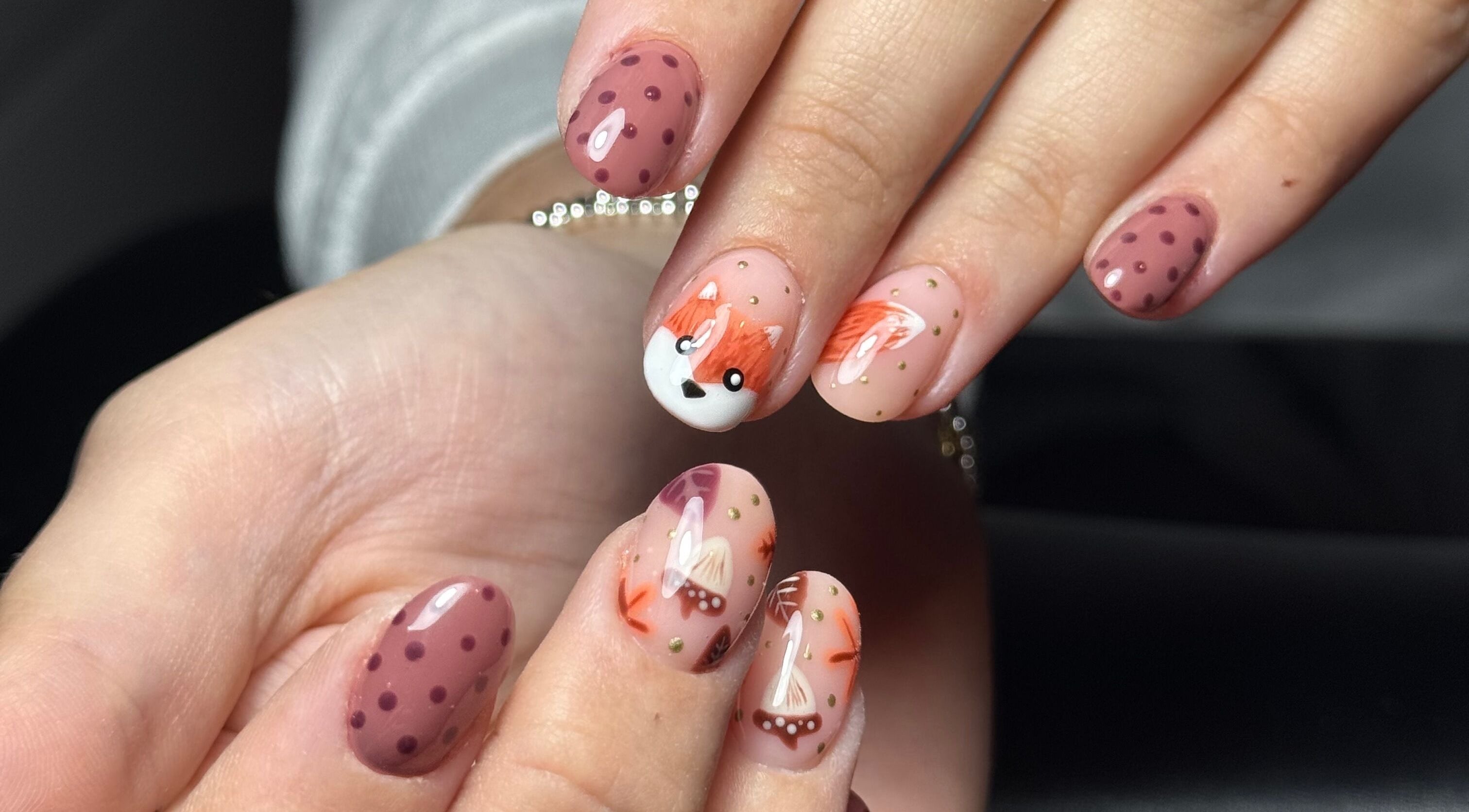 Whimsical nail art at The Flying Nail Tech, Middlewich, England, GB, featuring fox and polka dot designs.