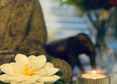 Elegant lotus and candle at Anna Massage Therapy & Spa, Newcastle upon Tyne, England, GB create serene ambiance.