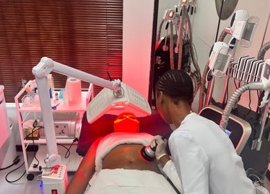 Therapist using red light therapy at Euphrates Wellness Clinic -Monument Park, Centurion, Gauteng, ZA.
