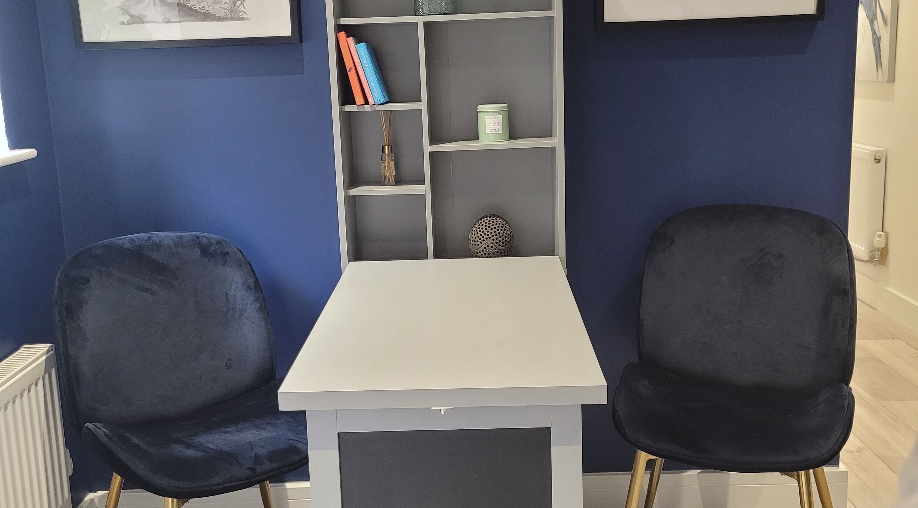 Elegant consultation area at Thrive Wellness Centre, Southampton, England, GB. Features a stylish blue decor.