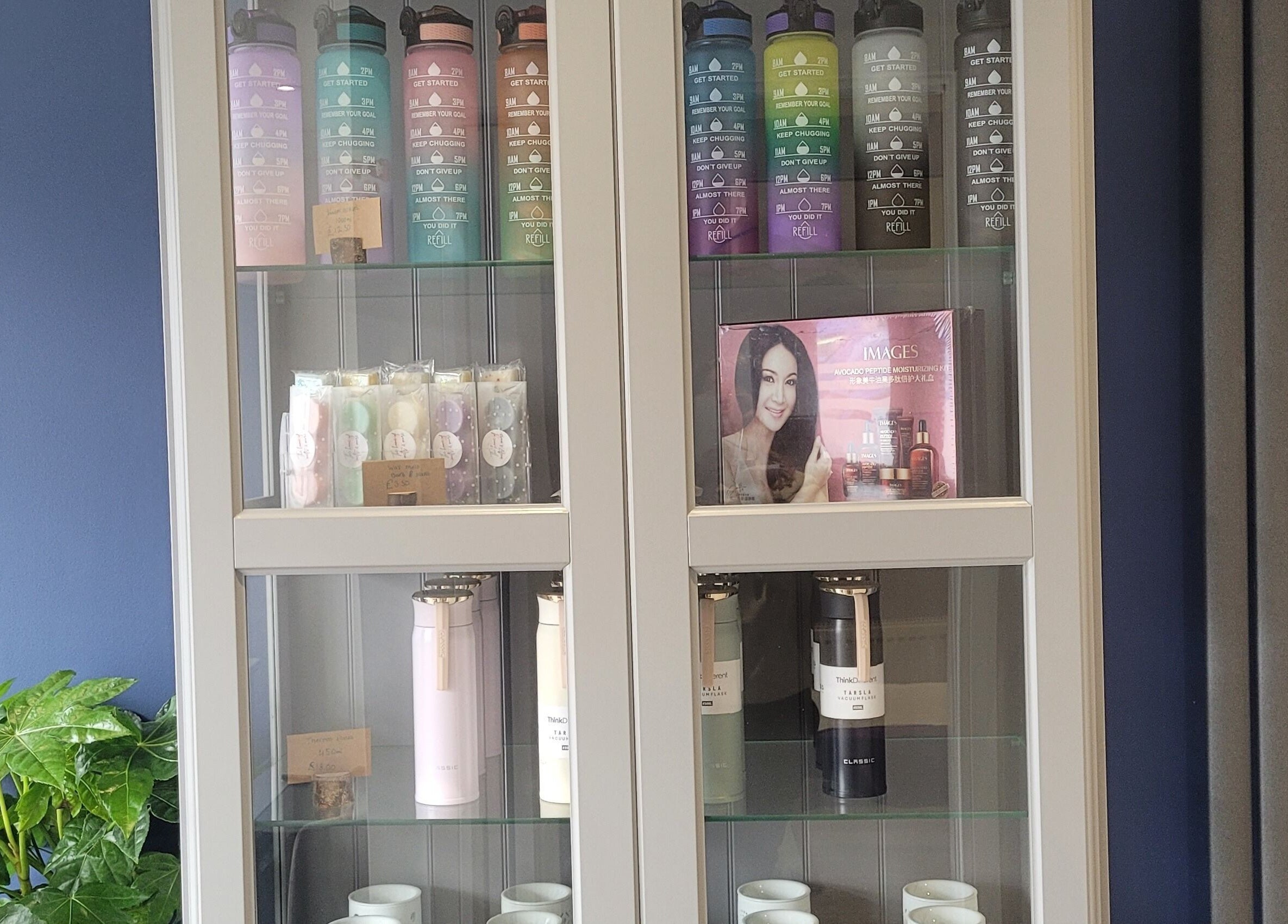 Product display at Thrive Wellness Centre, Southampton, England, GB featuring colorful bottles and wellness items.
