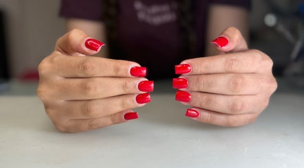 Red manicured nails at South Nail&Beauty Studio, Glasgow, Scotland, GB.
