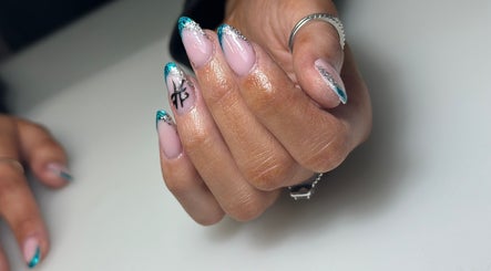 Manicured nails with blue tips at South Nail & Beauty Studio, Glasgow, Scotland, GB.