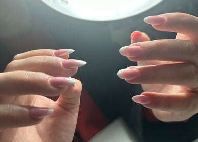 Stylish pink and white nails at South Nail & Beauty Studio, Glasgow, Scotland, GB.